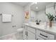 Bathroom with a large mirror, white cabinets, modern black hardware, and a floral print rug at 8348 Acadia Pkwy, Sherrills Ford, NC 28673