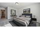 Bedroom featuring a dark blue bed frame, grey carpet, a desk, and a painting above the headboard at 8348 Acadia Pkwy, Sherrills Ford, NC 28673