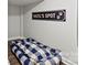 Basement dog room with a comfortable blue and white checkered dog bed at 8348 Acadia Pkwy, Sherrills Ford, NC 28673