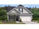 Two-story craftsman style home with gray siding and a two-car garage at 8348 Acadia Pkwy, Sherrills Ford, NC 28673