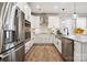 Modern kitchen with stainless steel appliances, white cabinets, and a kitchen island with a sink at 8348 Acadia Pkwy, Sherrills Ford, NC 28673