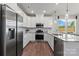 Modern kitchen with white cabinets, stainless steel appliances, and granite countertops at 8348 Acadia Pkwy, Sherrills Ford, NC 28673