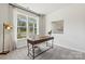 Home office with large window, wood desk, and neutral color palette at 8348 Acadia Pkwy, Sherrills Ford, NC 28673