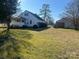 Wide backyard featuring well-maintained lawn, mature trees, and ample sunlight at 897 Mocksville Hwy, Statesville, NC 28625