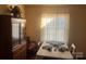 Dining area with a china cabinet and window at 897 Mocksville Hwy, Statesville, NC 28625