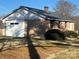 Backyard view of home featuring a concrete block foundation and ample yard space at 897 Mocksville Hwy, Statesville, NC 28625