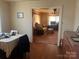 View of the living room from the dining room; hardwood floors at 897 Mocksville Hwy, Statesville, NC 28625