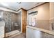 Bathroom featuring a glass-enclosed shower, wooden cabinet, and light-colored granite countertop at 10 Catawba Ridge Ct, Clover, SC 29710