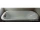 Vintage bathtub with classic fixtures provides a luxurious soak, enhancing the bathroom's charm at 105 N Inman Ave, Bessemer City, NC 28016
