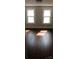 Bedroom with hardwood floors and two windows at 105 N Inman Ave, Bessemer City, NC 28016