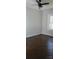 This bedroom features hardwood floors and a ceiling fan at 105 N Inman Ave, Bessemer City, NC 28016