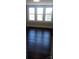 Bedroom with hardwood floors and three windows at 105 N Inman Ave, Bessemer City, NC 28016