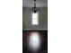 Bright dining room with beautiful dark hardwood floors and decorative lighting at 105 N Inman Ave, Bessemer City, NC 28016