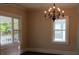 Bright dining room featuring a chandelier and hardwood floors at 105 N Inman Ave, Bessemer City, NC 28016