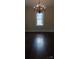 Bright dining room featuring an elegant chandelier and hardwood floors at 105 N Inman Ave, Bessemer City, NC 28016