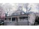 Inviting two-story home featuring a charming covered porch, perfect for enjoying the outdoors in comfort and style at 105 N Inman Ave, Bessemer City, NC 28016