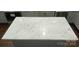 Close-up of the kitchen island featuring a countertop with black speckled detail at 105 N Inman Ave, Bessemer City, NC 28016