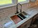 The kitchen sink boasts granite countertops, a stainless steel sink, and a modern faucet at 105 N Inman Ave, Bessemer City, NC 28016