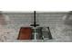 Modern kitchen sink with accessories, granite countertops, and tile backsplash at 105 N Inman Ave, Bessemer City, NC 28016