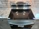 New kitchen stainless steel cook top and granite countertops offer a modern aesthetic at 105 N Inman Ave, Bessemer City, NC 28016