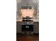 New stainless steel range and hood, subway tile backsplash and gray cabinets are standout features in the kitchen at 105 N Inman Ave, Bessemer City, NC 28016