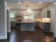 Bright and spacious kitchen with an island, gray cabinets and modern appliances at 105 N Inman Ave, Bessemer City, NC 28016