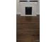 Inviting living room with dark hardwood floors and a painted fireplace at 105 N Inman Ave, Bessemer City, NC 28016