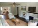 Staged living room with hardwood floors, a fireplace, and comfortable seating at 105 N Inman Ave, Bessemer City, NC 28016