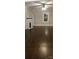 Spacious living room with wood floors, fireplace, and natural light at 105 N Inman Ave, Bessemer City, NC 28016