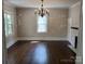 Spacious living room with hardwood floors and lots of natural light at 105 N Inman Ave, Bessemer City, NC 28016