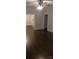 Inviting living room with sleek, dark hardwood floors and a modern ceiling fan at 105 N Inman Ave, Bessemer City, NC 28016