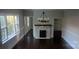 Open-concept living room featuring a fireplace and open entry at 105 N Inman Ave, Bessemer City, NC 28016