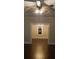 View of a chandelier through the doorway in a living room with dark wood floors at 105 N Inman Ave, Bessemer City, NC 28016