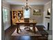 Charming office with hardwood floors, built in shelving, large desk and a decorative chandelier at 105 N Inman Ave, Bessemer City, NC 28016