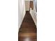 Wooden staircase featuring white painted banister and trim at 105 N Inman Ave, Bessemer City, NC 28016
