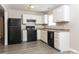 Efficient kitchen featuring white cabinets and black appliances at 106 Eighth St, York, SC 29745