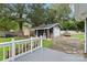 A large backyard featuring a deck, storage, garage, and plenty of entertaining space at 107 Deese Ct, Indian Trail, NC 28079