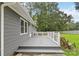 A nice backyard featuring an outdoor deck and plenty of well-maintained green space at 107 Deese Ct, Indian Trail, NC 28079