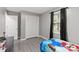 Bedroom with luxury vinyl floors, closet with white doors and natural light at 107 Deese Ct, Indian Trail, NC 28079