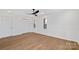 Bright bedroom with hardwood floors and wainscoting at 10906 Pampas Cir, Charlotte, NC 28226