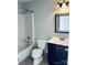 Full bathroom featuring a shower-tub combo, toilet, and vanity, maximizing space efficiency at 10933 Harrowfield Rd, Charlotte, NC 28226