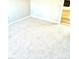 Simple carpeted bedroom with neutral walls and a window at 10933 Harrowfield Rd, Charlotte, NC 28226