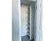 Organized closet features multiple shelves, offering ample storage space for clothing and accessories at 10933 Harrowfield Rd, Charlotte, NC 28226
