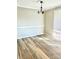 Bright dining room with light gray walls and wood-look flooring at 10933 Harrowfield Rd, Charlotte, NC 28226