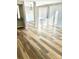 Spacious living room with wood-look floors and a dining area at 10933 Harrowfield Rd, Charlotte, NC 28226