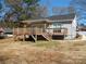 Back of the house showing the wooden deck at 1120 Cedar St, Mount Holly, NC 28120