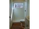 Bathroom featuring a corner shower with glass door and bright window at 1120 Cedar St, Mount Holly, NC 28120