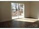 Bedroom with sliding glass door and deck overlooking lake at 1120 Cedar St, Mount Holly, NC 28120