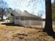 The exterior of the house, showcasing the backyard with a white picket fence at 1120 Cedar St, Mount Holly, NC 28120