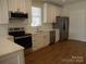 Modern kitchen featuring stainless steel appliances, white cabinets, subway tile backsplash, and sleek countertops at 1120 Cedar St, Mount Holly, NC 28120